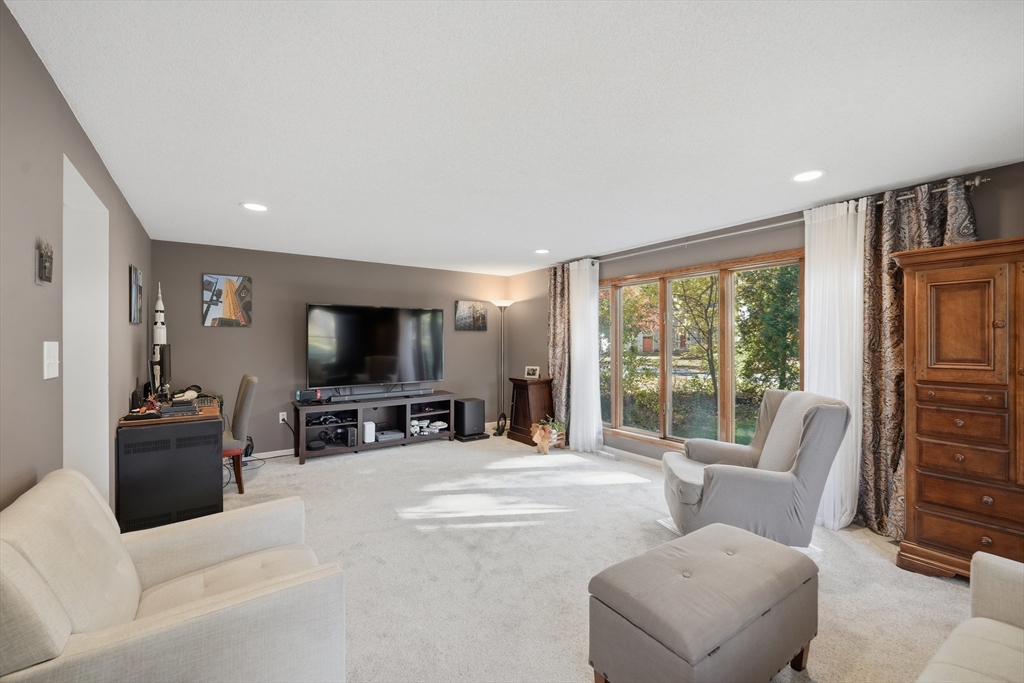 5 Ferncroft Street Longmeadow, MA 01106 - Photo 20 of 40 a living room with furniture and a flat screen tv