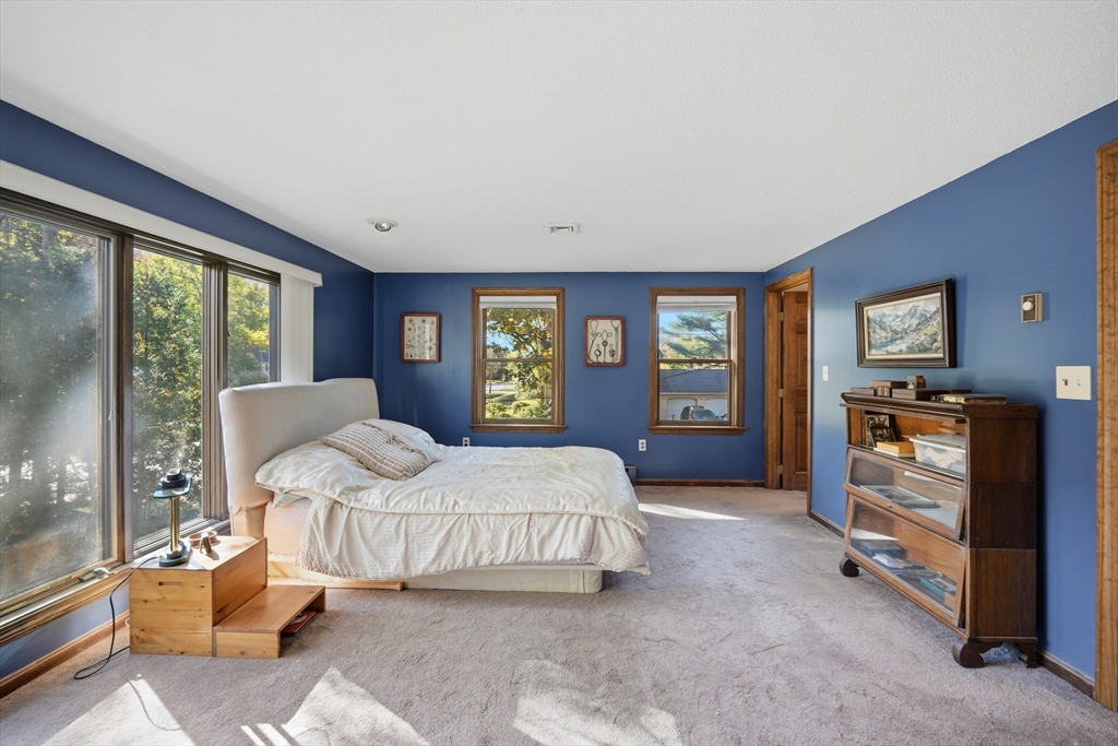 5 Ferncroft Street Longmeadow, MA 01106 - Photo 23 of 40 a bedroom with a bed and large windows