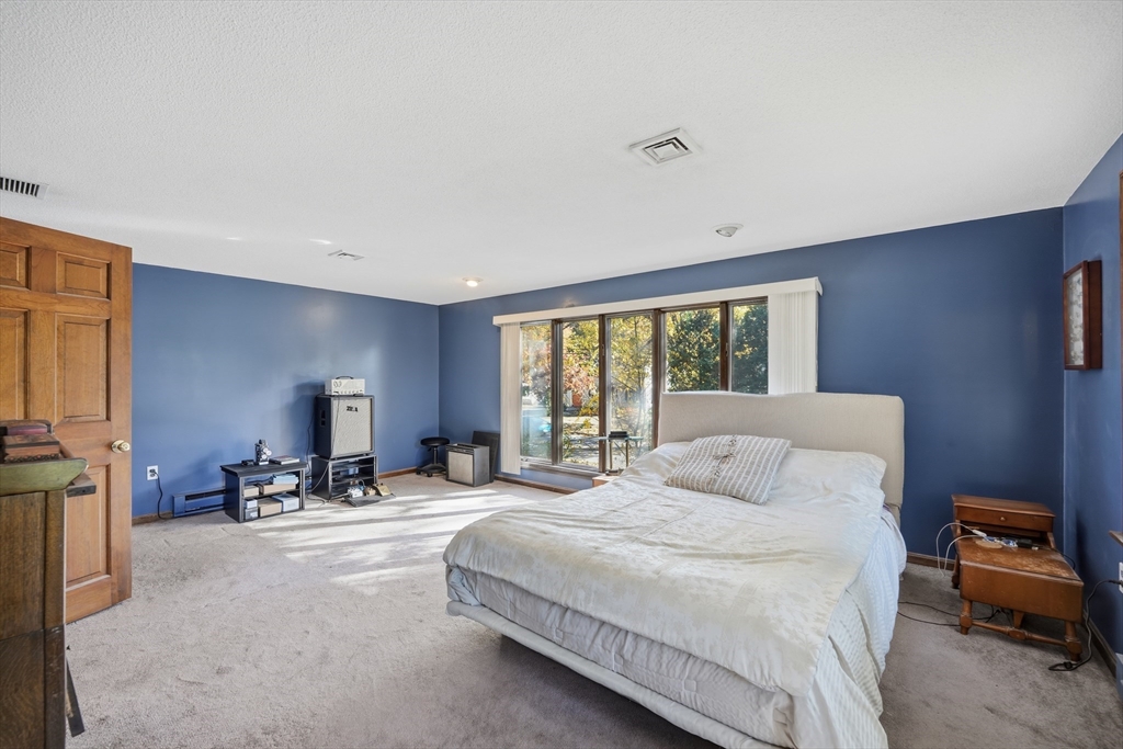 5 Ferncroft Street Longmeadow, MA 01106 - Photo 24 of 40 a bedroom with a bed and a couch