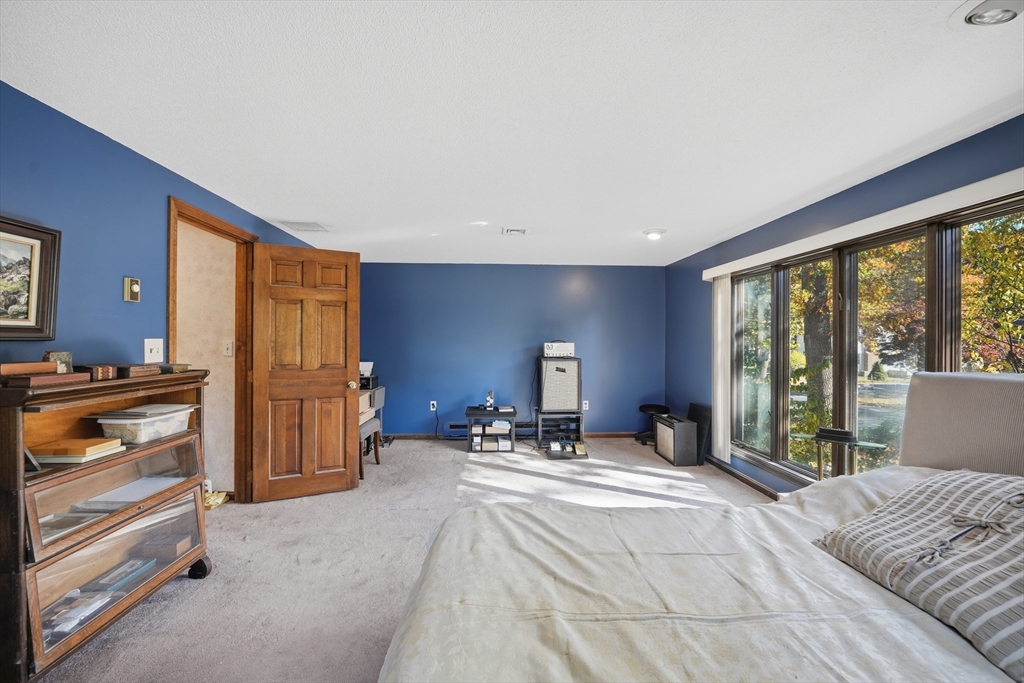 5 Ferncroft Street Longmeadow, MA 01106 - Photo 25 of 40 a bedroom with a bed and large windows