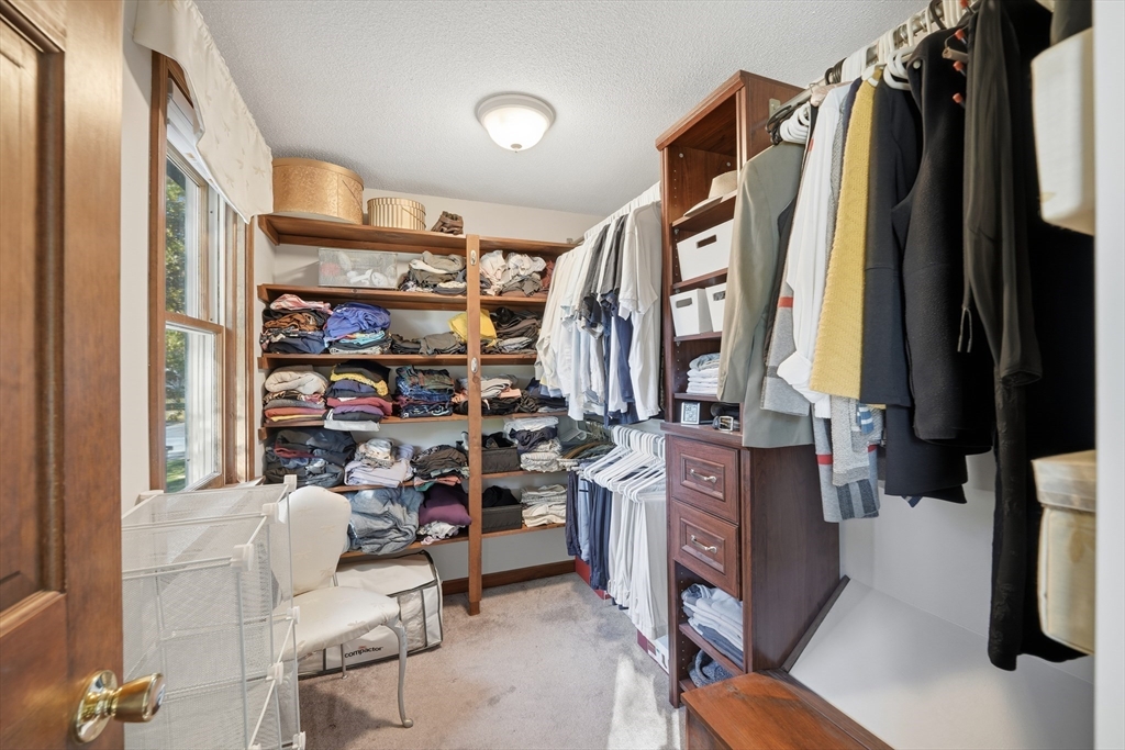 5 Ferncroft Street Longmeadow, MA 01106 - Photo 26 of 40 a view of walk in closet with clothes and shoes