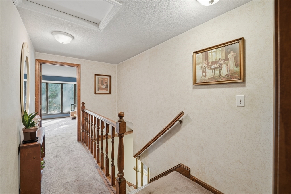 5 Ferncroft Street Longmeadow, MA 01106 - Photo 31 of 40 a view of hallway with stairs and wooden floor