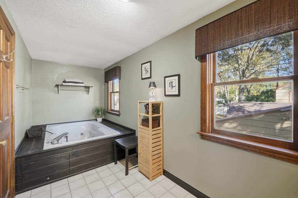 5 Ferncroft Street Longmeadow, MA 01106 - Photo 32 of 40 a bathroom with a bathtub and a window