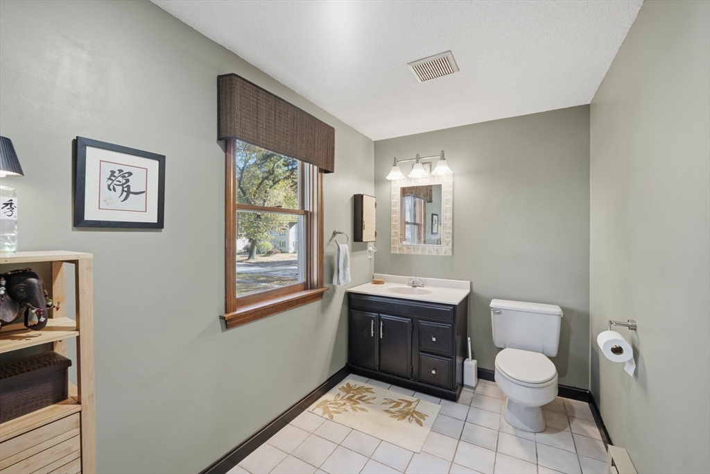 5 Ferncroft Street Longmeadow, MA 01106 - Photo 33 of 40 a bathroom with a toilet a sink and a mirror