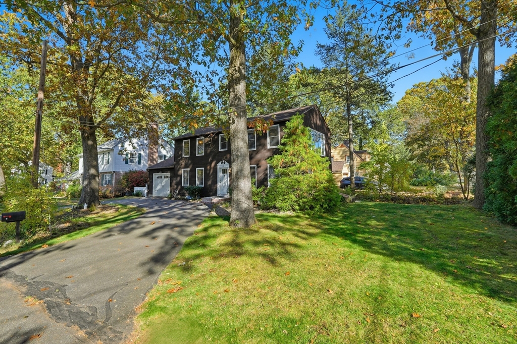 5 Ferncroft Street Longmeadow, MA 01106 - Photo 4 of 40 a view of a backyard with plants and large trees