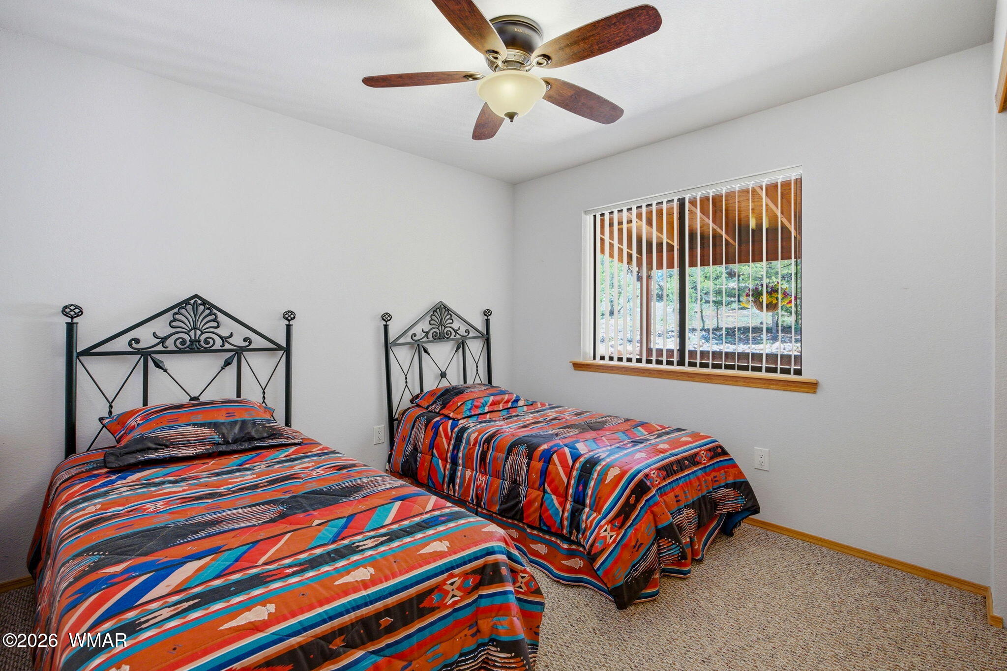 2806 Sky Hawk Drive Overgaard, AZ 85933 - Photo 18 of 43 a bedroom with two beds and a window
