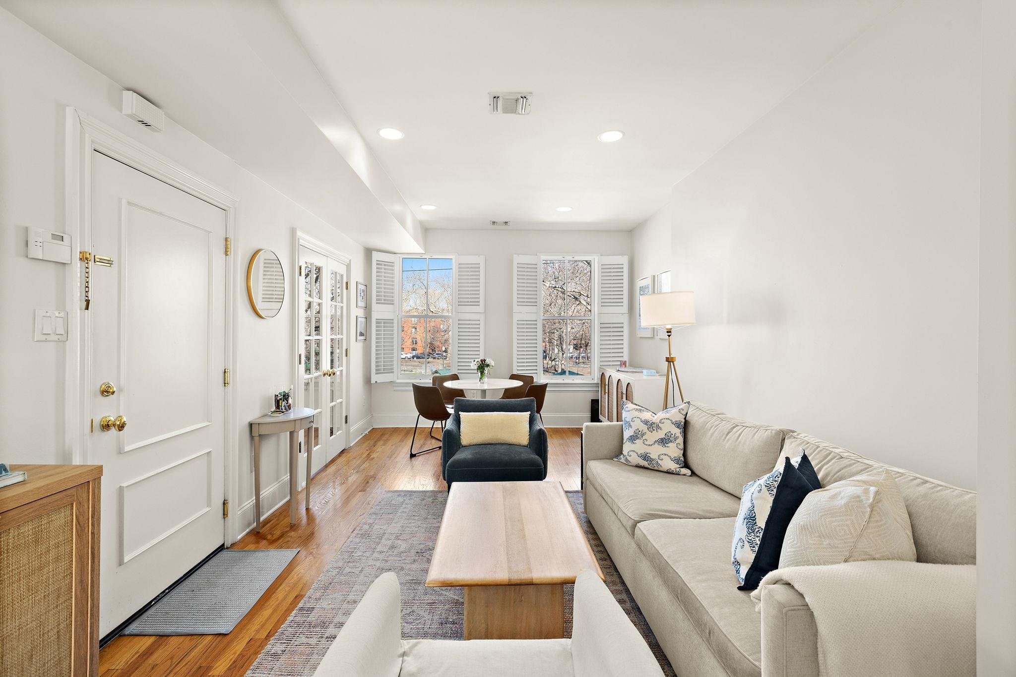 a living room with furniture and a rug