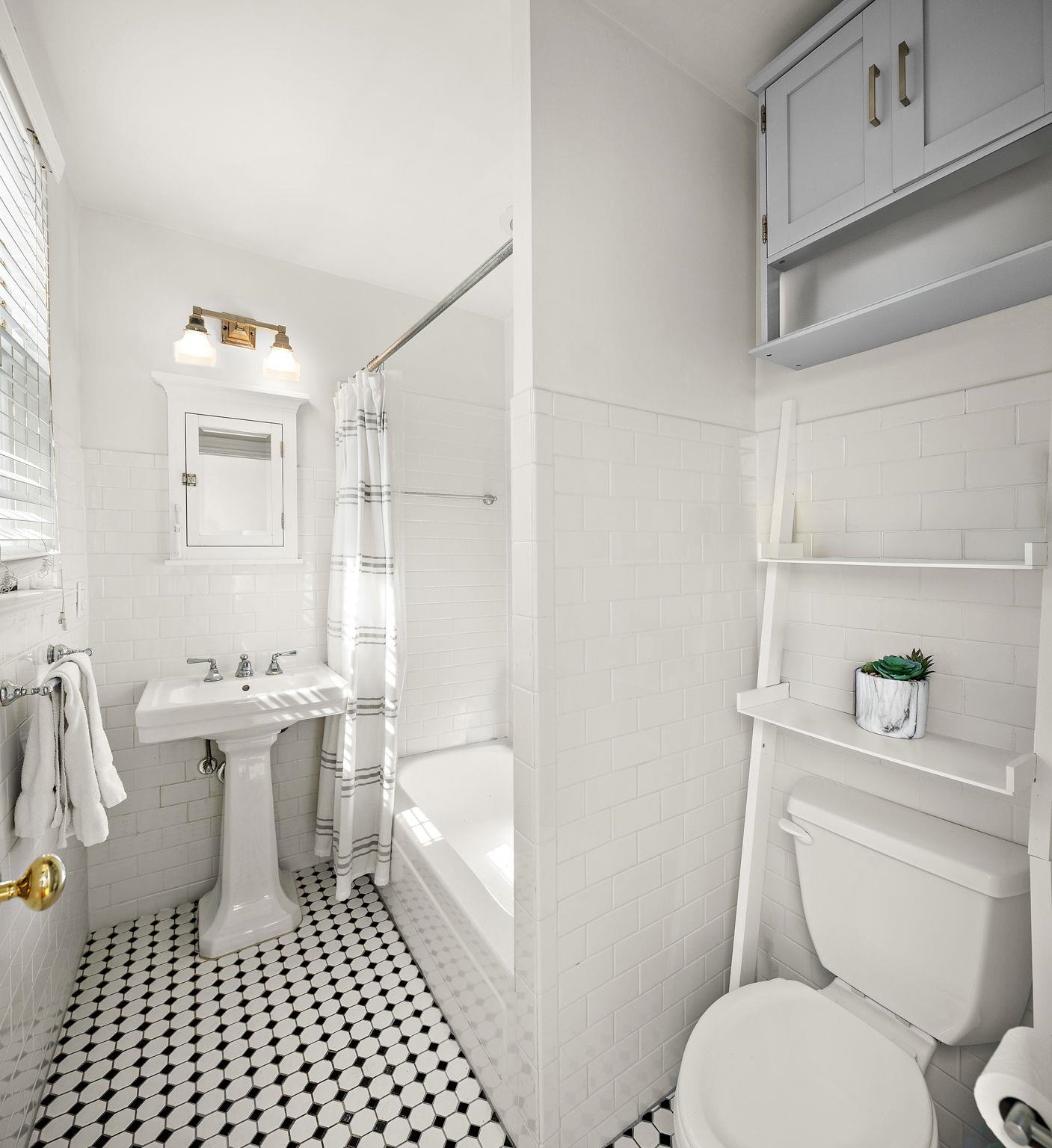 259 4th Street, Unit 2 Hoboken, NJ 07030 - Photo 14 of 20 a bathroom with a toilet a sink and a bathtub