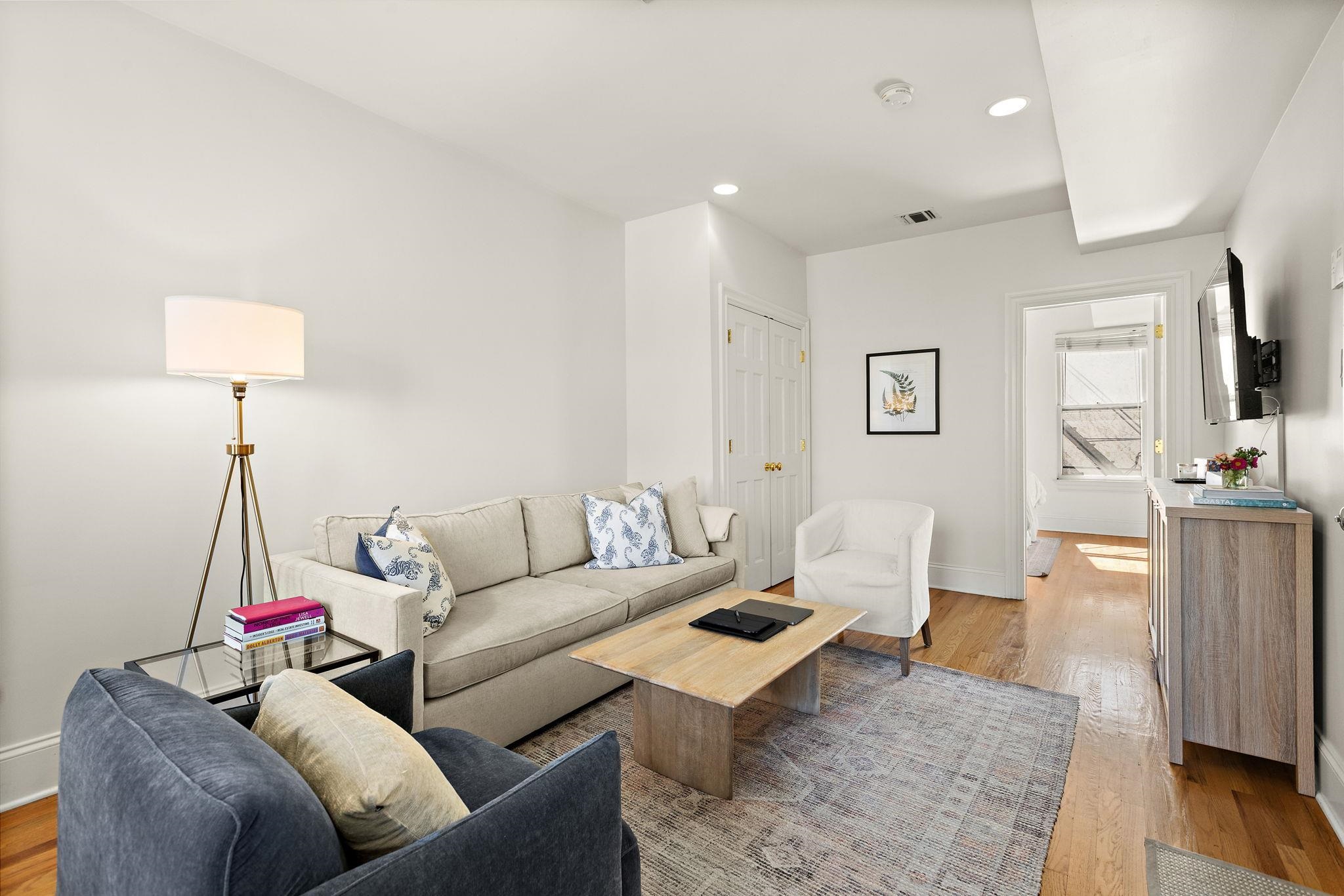 259 4th Street, Unit 2 Hoboken, NJ 07030 - Photo 5 of 20 a living room with furniture and a wooden floor