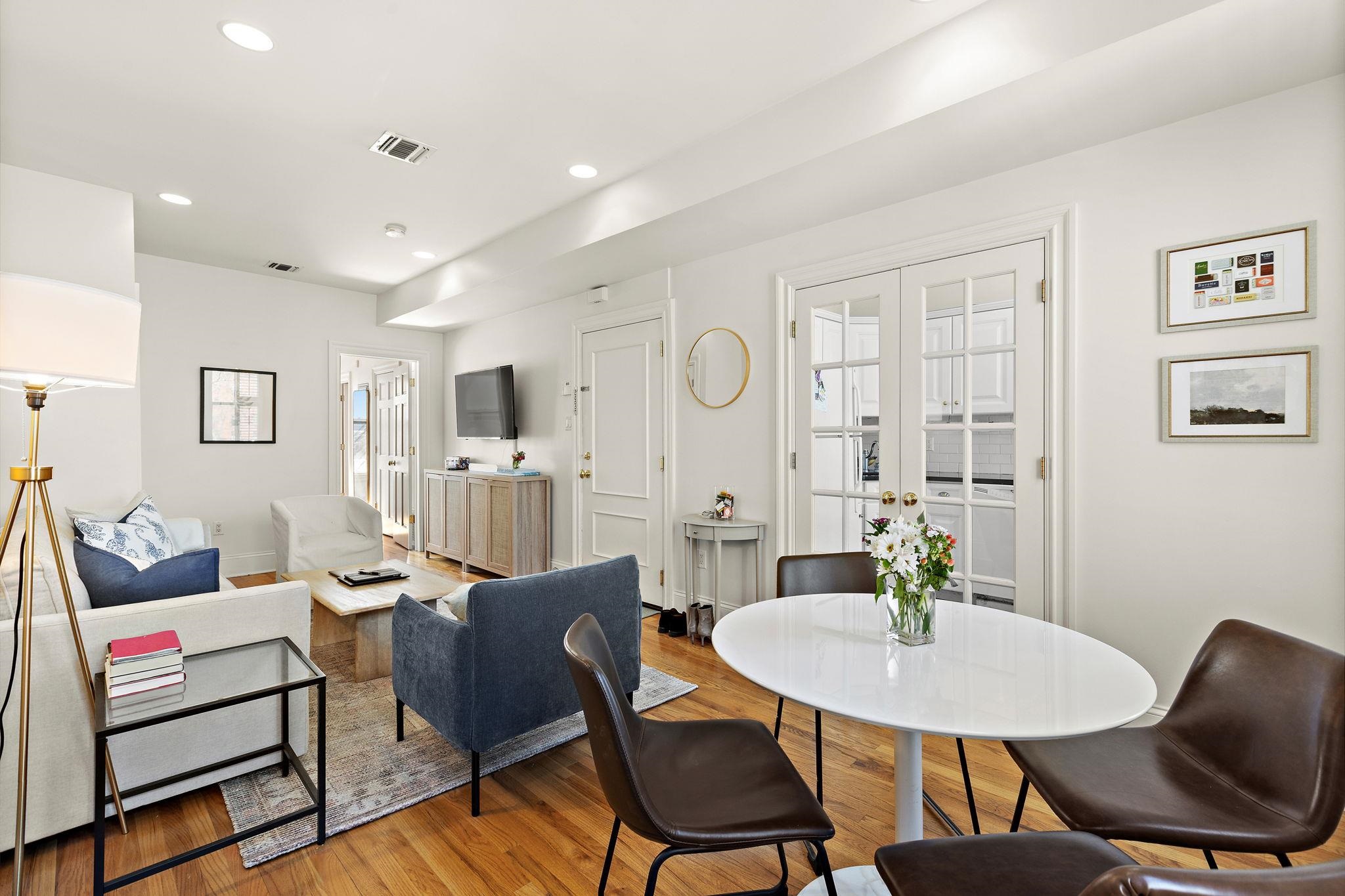 259 4th Street, Unit 2 Hoboken, NJ 07030 - Photo 7 of 20 a view of a dining room with furniture and wooden floor