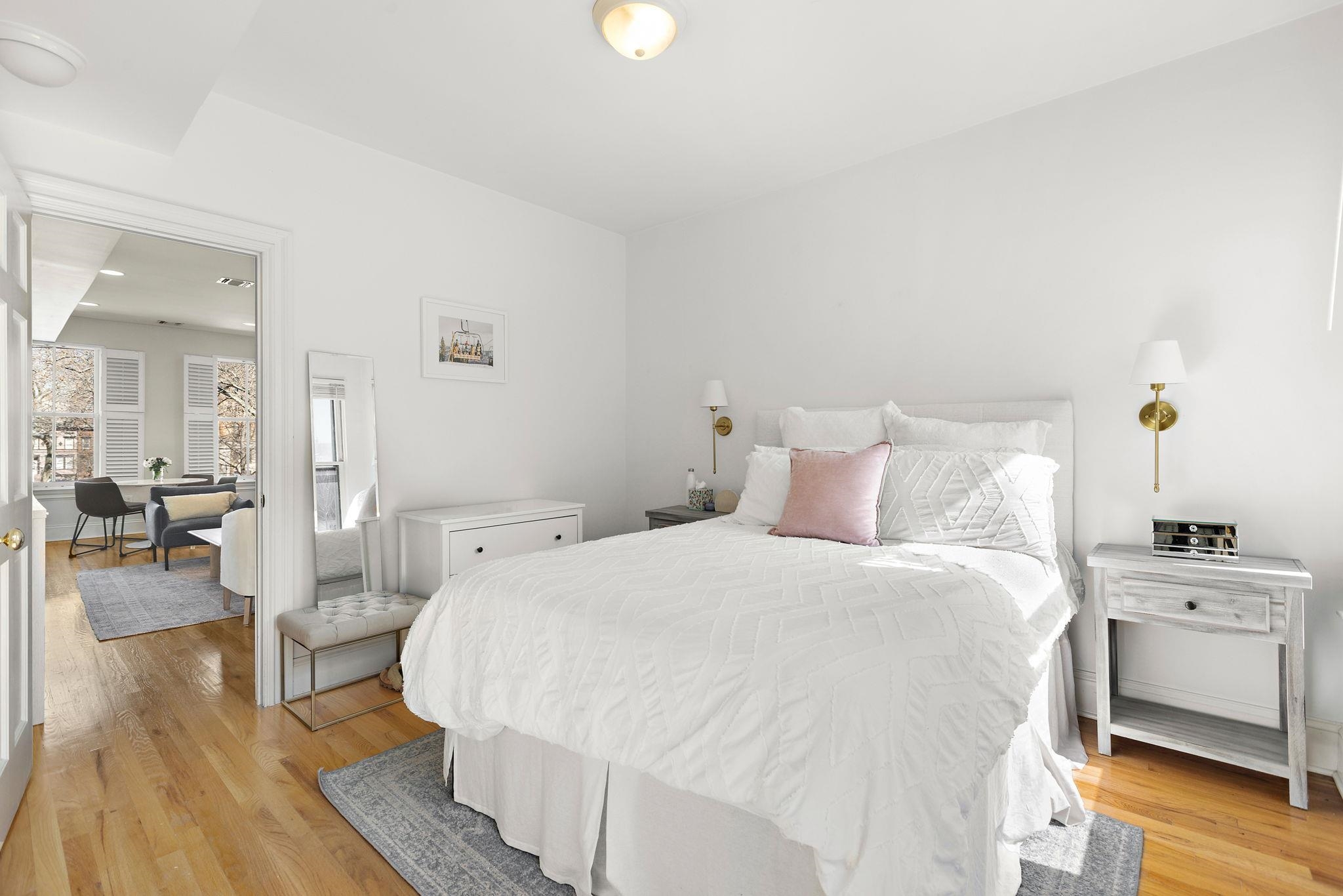 259 4th Street, Unit 2 Hoboken, NJ 07030 - Photo 10 of 20 a spacious bedroom with a bed and wooden floor