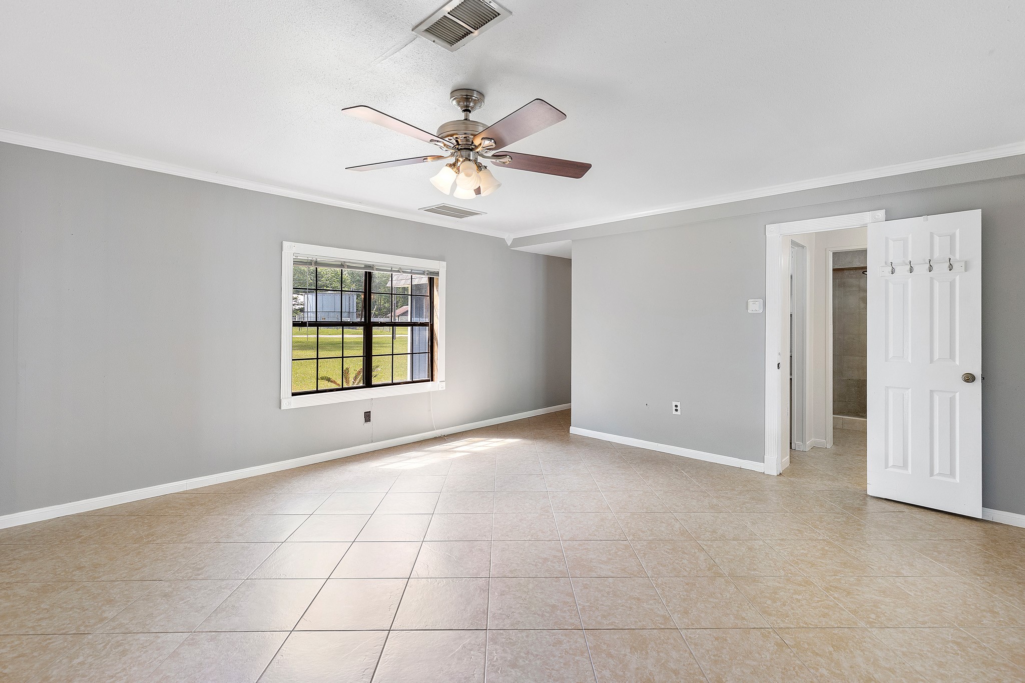 230 Walnut Drive Trinity, TX 75862 - Photo 13 of 48 Unwind in your own private sanctuary—an expansive primary retreat designed for comfort and style. This oversized haven features wall-to-wall closets, offering incredible storage without compromising elegance. The luxurious ensuite bath completes the space, creating a perfect blend of function and relaxation for your daily escape.