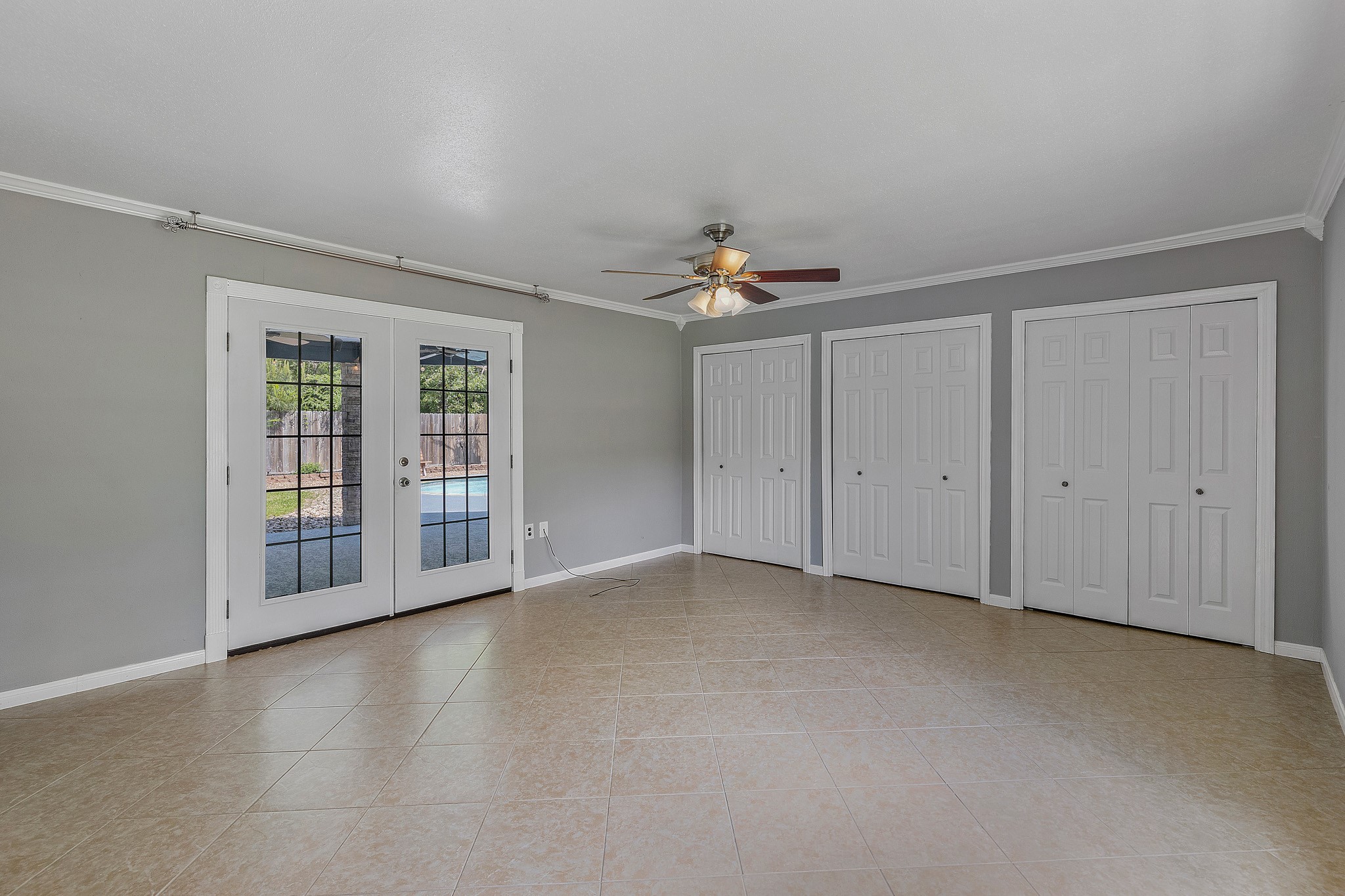 230 Walnut Drive Trinity, TX 75862 - Photo 14 of 48 Step through elegant French doors from the primary suite onto a covered patio that leads to the sparkling pool—your own private oasis just steps away. Whether you're enjoying morning coffee or an evening swim, this seamless indoor-outdoor flow brings luxury and tranquility to everyday living.