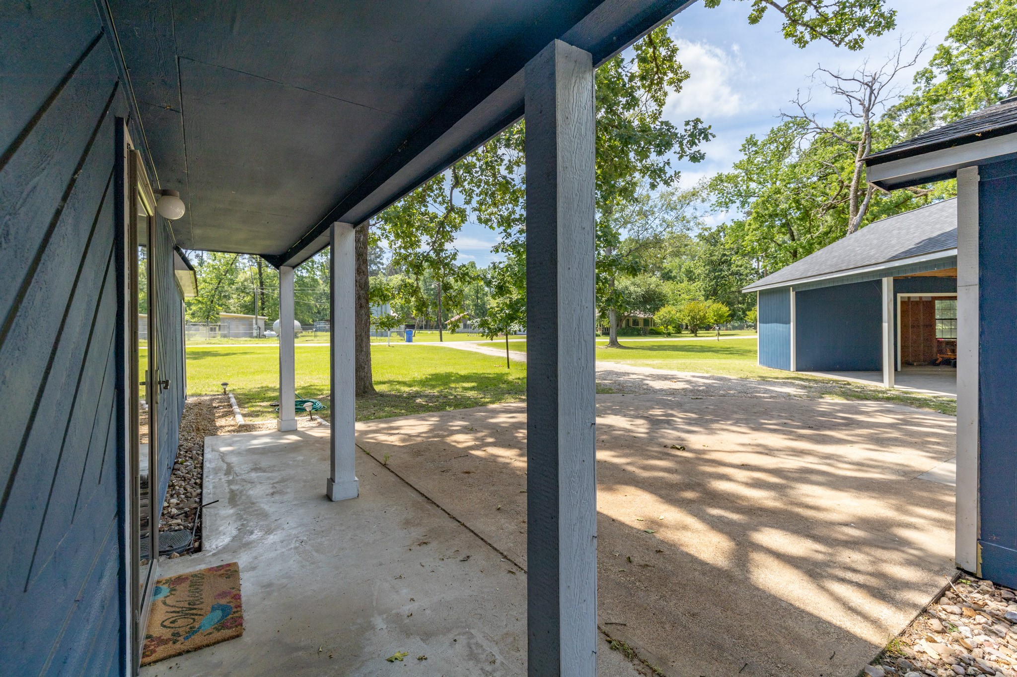 230 Walnut Drive Trinity, TX 75862 - Photo 2 of 48 The large, covered front porch sets the tone with warmth and charm—perfect for greeting guests or enjoying the view