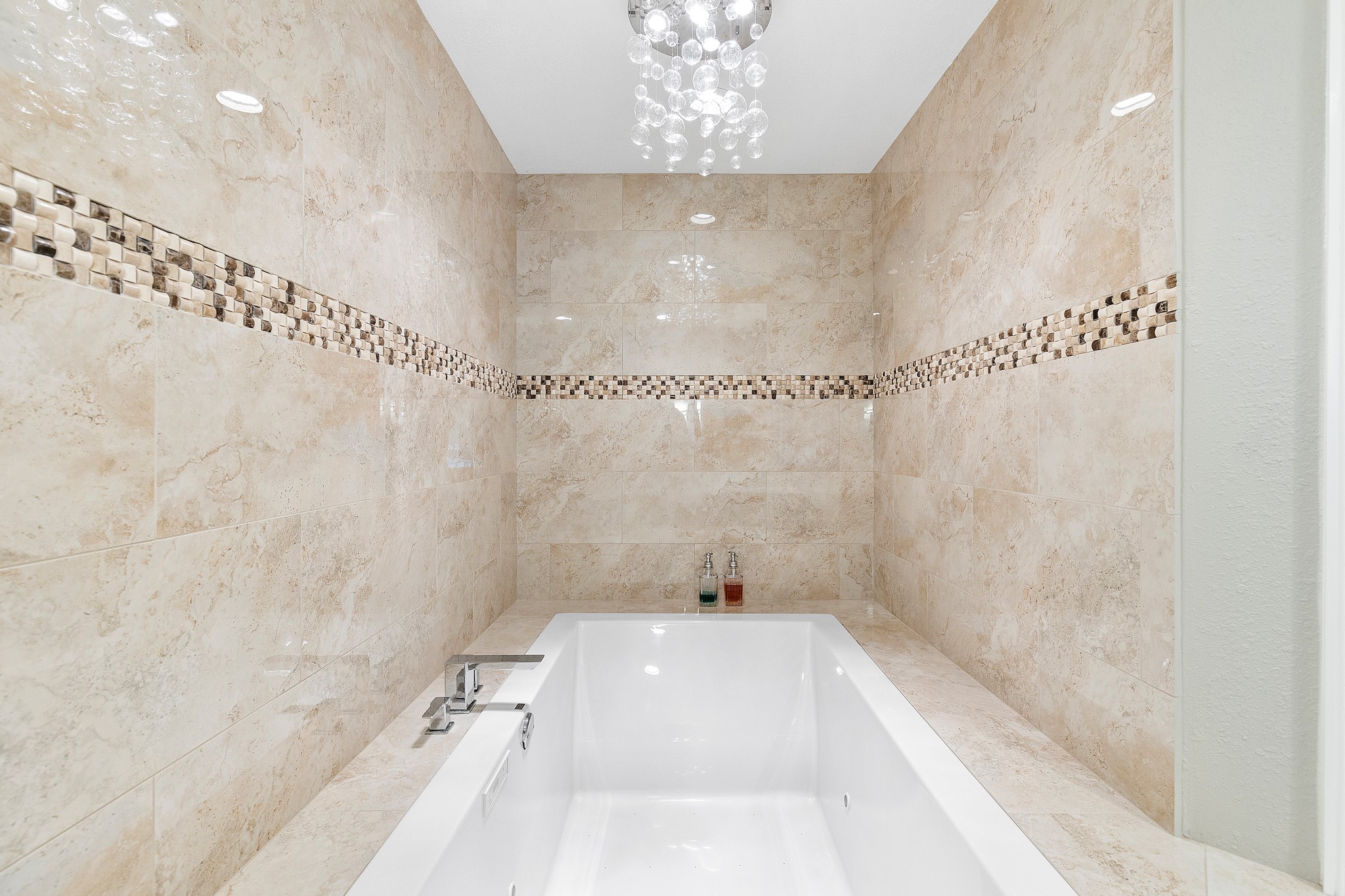 230 Walnut Drive Trinity, TX 75862 - Photo 24 of 48 Indulge in a soaking tub so impressively large, it truly has to be seen to be believed. Whether you're looking to relax after a long day or enjoy a luxurious spa-like escape, this statement piece transforms the bath into a personal sanctuary.