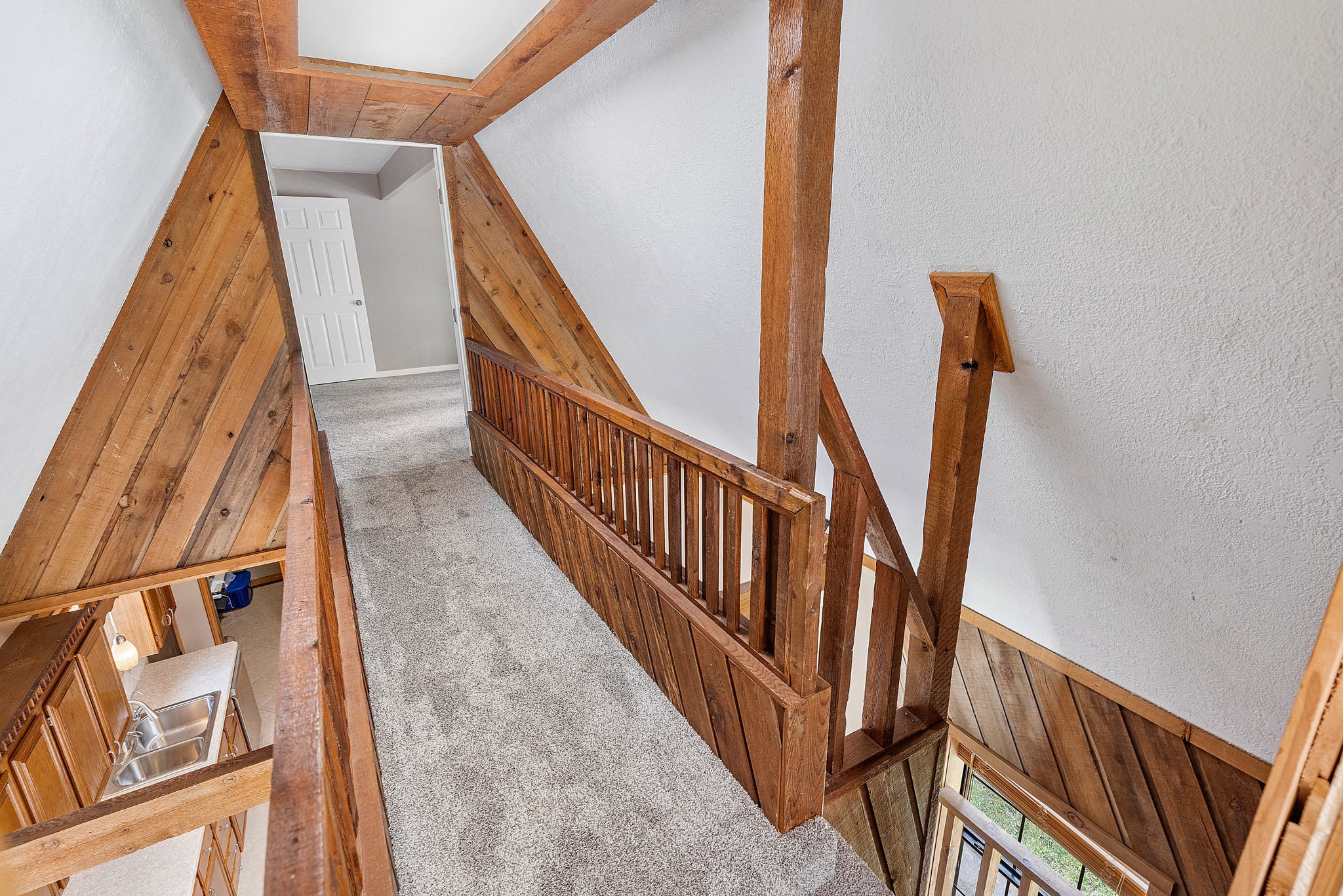 230 Walnut Drive Trinity, TX 75862 - Photo 25 of 48 Here's a view of the catwalk over the kitchen!