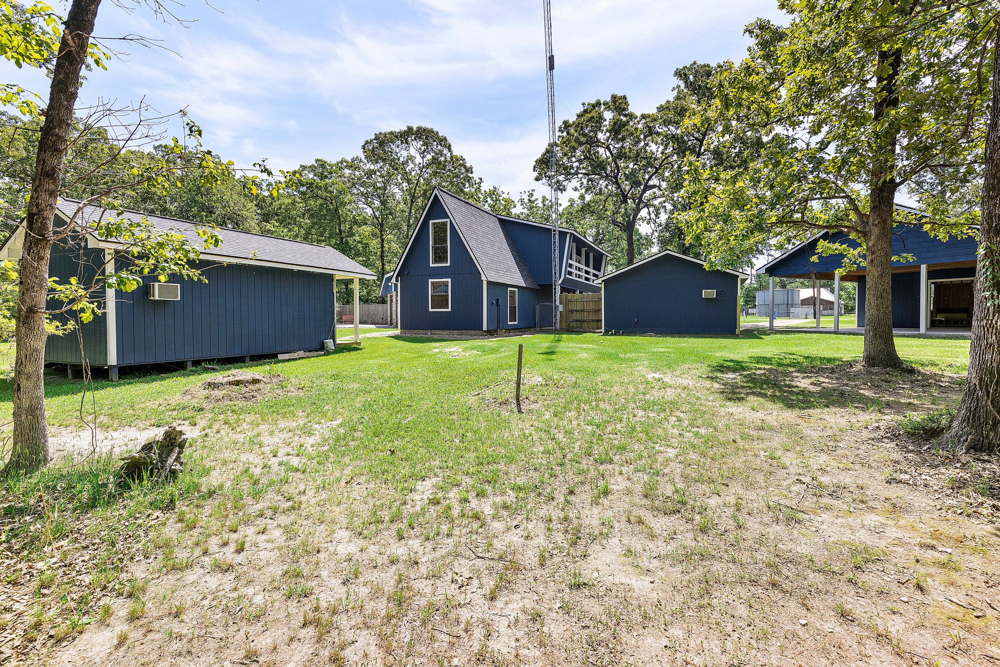 230 Walnut Drive Trinity, TX 75862 - Photo 32 of 48 Looking from behind the house and shed, here you can see the internet tower. This provides internet to the community and because it's on your property, you get your internet FREE for life!