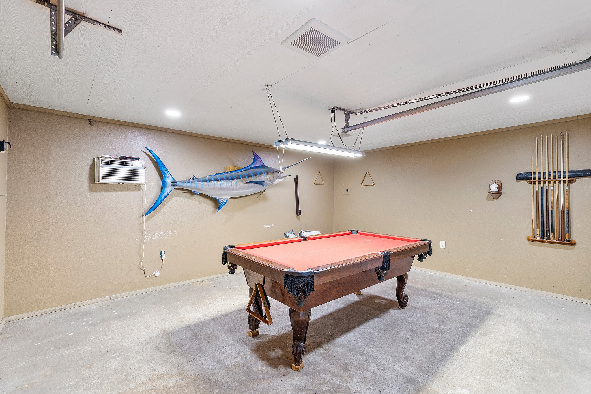 230 Walnut Drive Trinity, TX 75862 - Photo 41 of 48 Garage with air conditioning? Yes, please! Stay cool while you shoot pool, tinker on projects, or turn it into the ultimate hangout space.