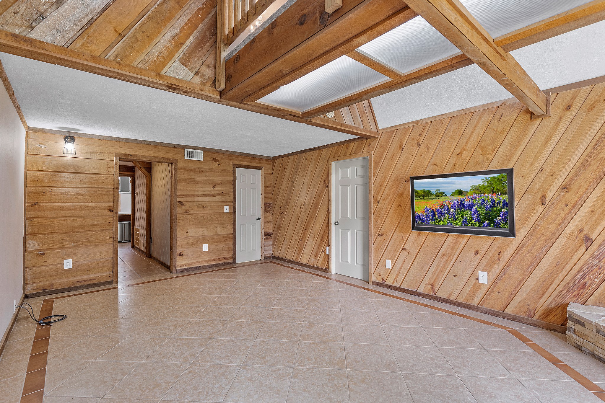 230 Walnut Drive Trinity, TX 75862 - Photo 6 of 48 Step into a one-of-a-kind family retreat where rustic charm meets natural elegance.