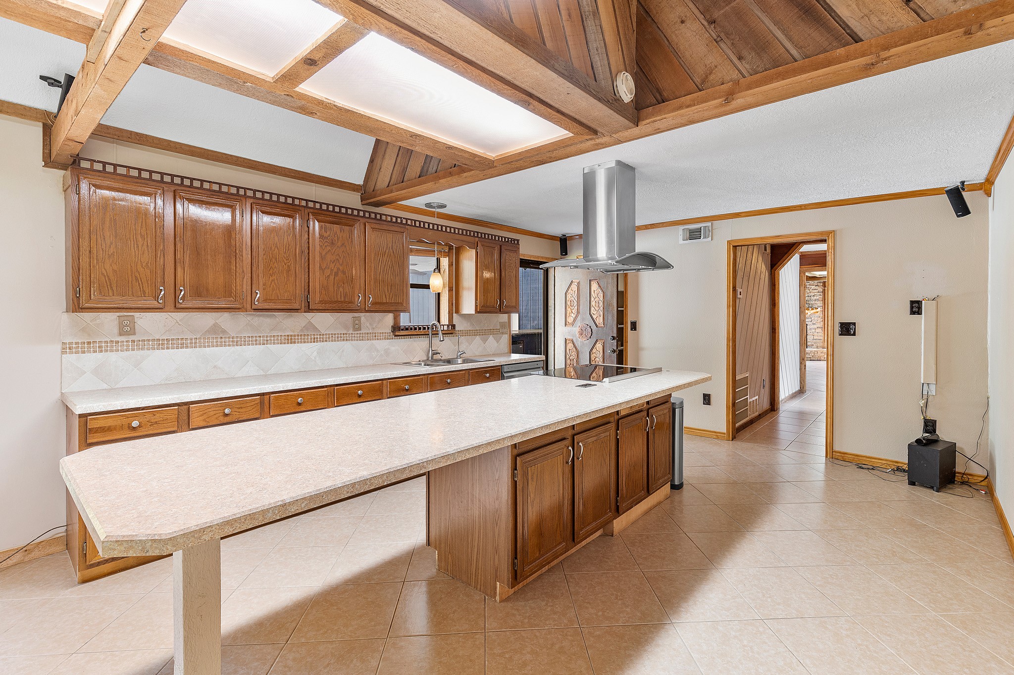 230 Walnut Drive Trinity, TX 75862 - Photo 10 of 48 Look at all of that space! Plenty of room for all of the chefs in the family! This kitchen is also wired for sound!