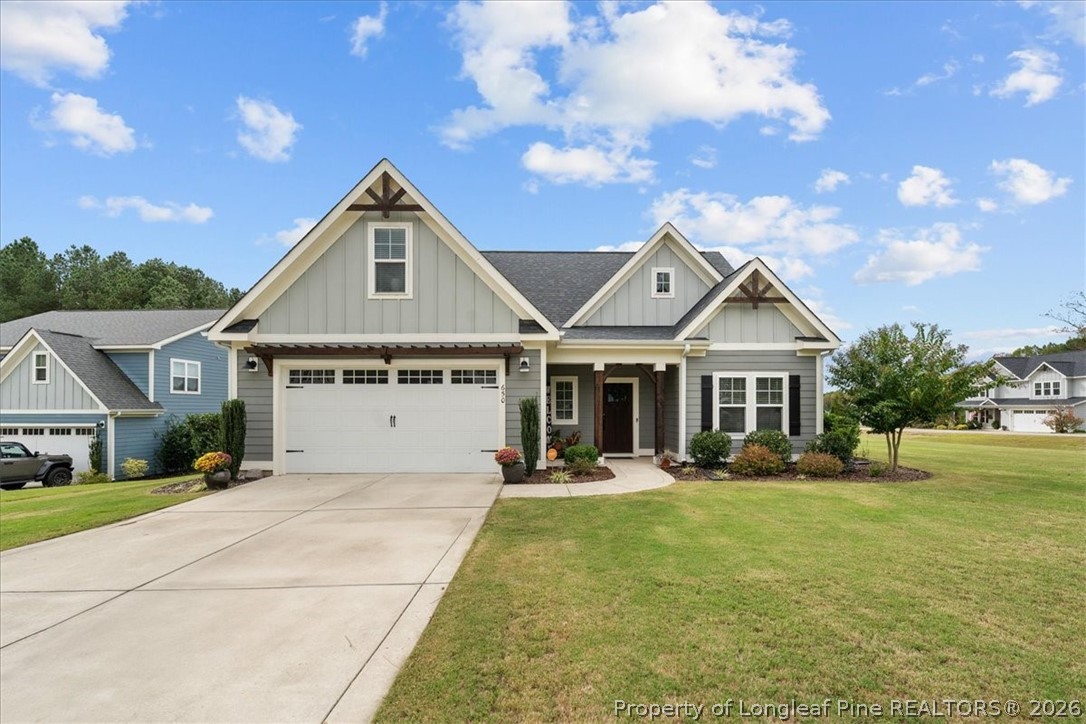 650 Cromwell Court Carthage, NC 28327 - Photo 1 of 39 a front view of house with yard and green space
