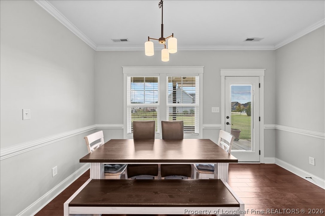 650 Cromwell Court Carthage, NC 28327 - Photo 14 of 39 a view of a dining room with furniture window and wooden floor