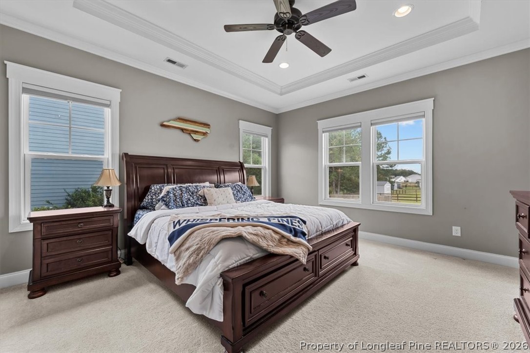 650 Cromwell Court Carthage, NC 28327 - Photo 16 of 39 a spacious bedroom with a bed and a window