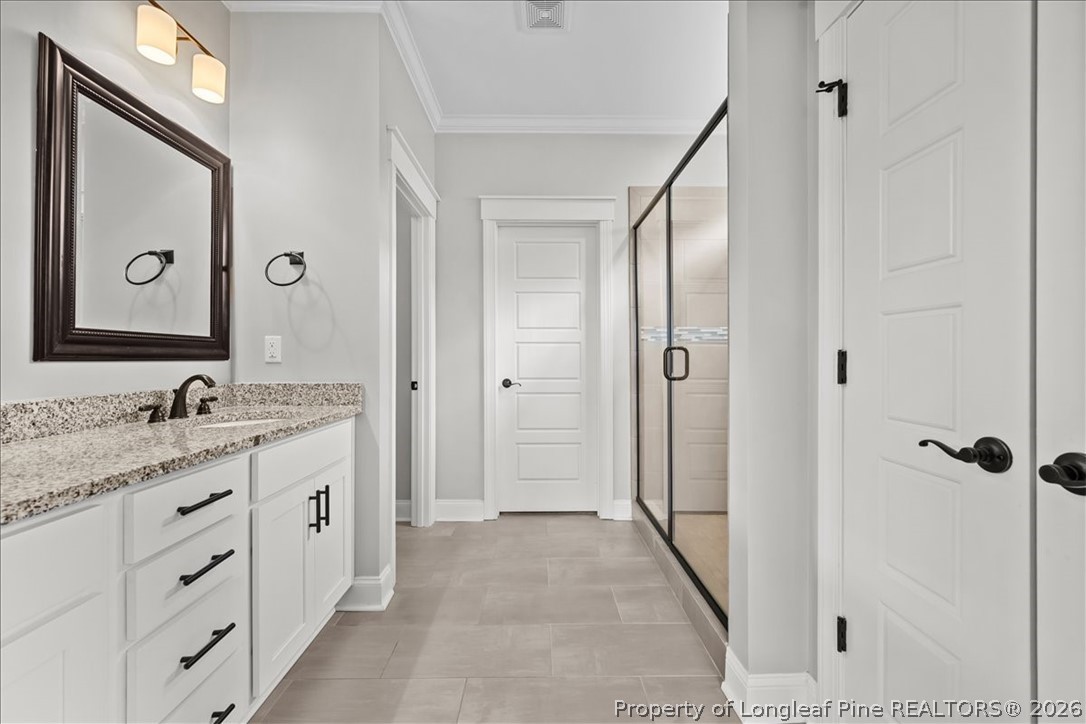 650 Cromwell Court Carthage, NC 28327 - Photo 18 of 39 a bathroom with a granite countertop sink mirror and a