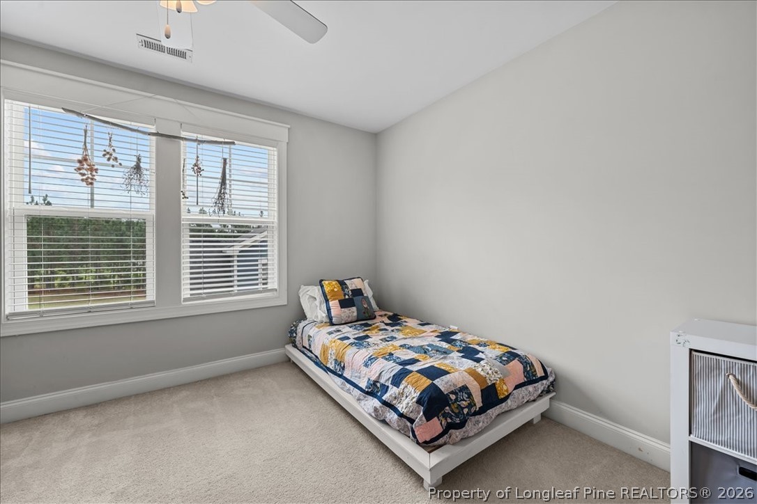 650 Cromwell Court Carthage, NC 28327 - Photo 24 of 39 a bedroom with a bed and a window