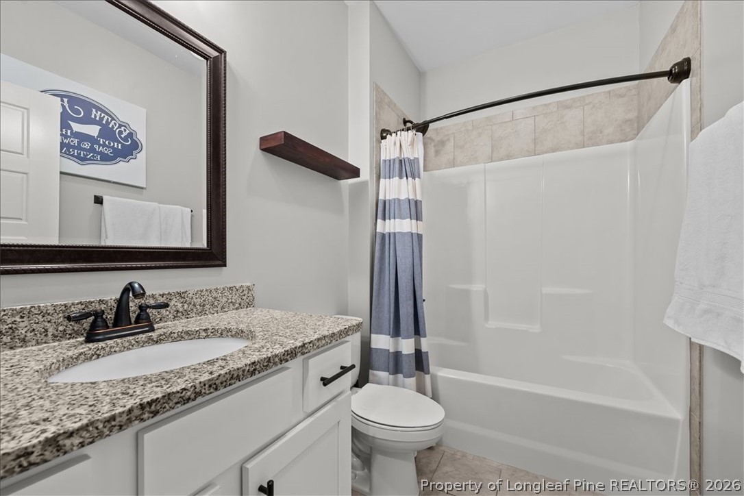 650 Cromwell Court Carthage, NC 28327 - Photo 27 of 39 a bathroom with a granite countertop sink toilet and shower