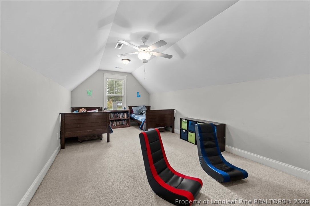 650 Cromwell Court Carthage, NC 28327 - Photo 28 of 39 a living room with furniture and a chandelier