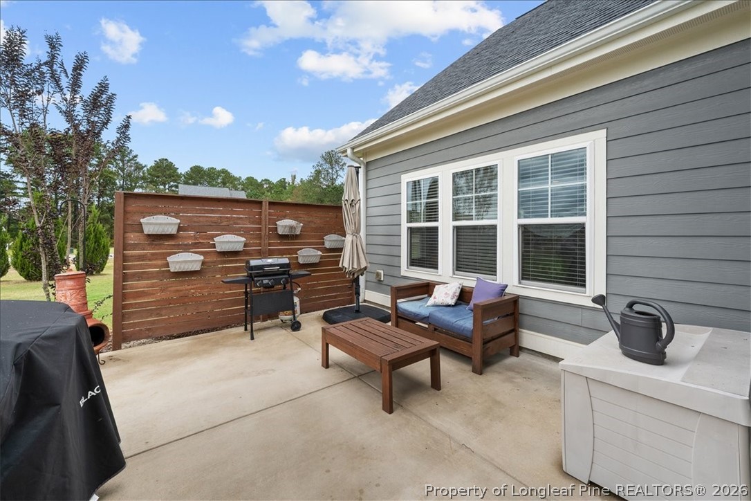 650 Cromwell Court Carthage, NC 28327 - Photo 35 of 39 a building outdoor space with patio furniture and potted plants