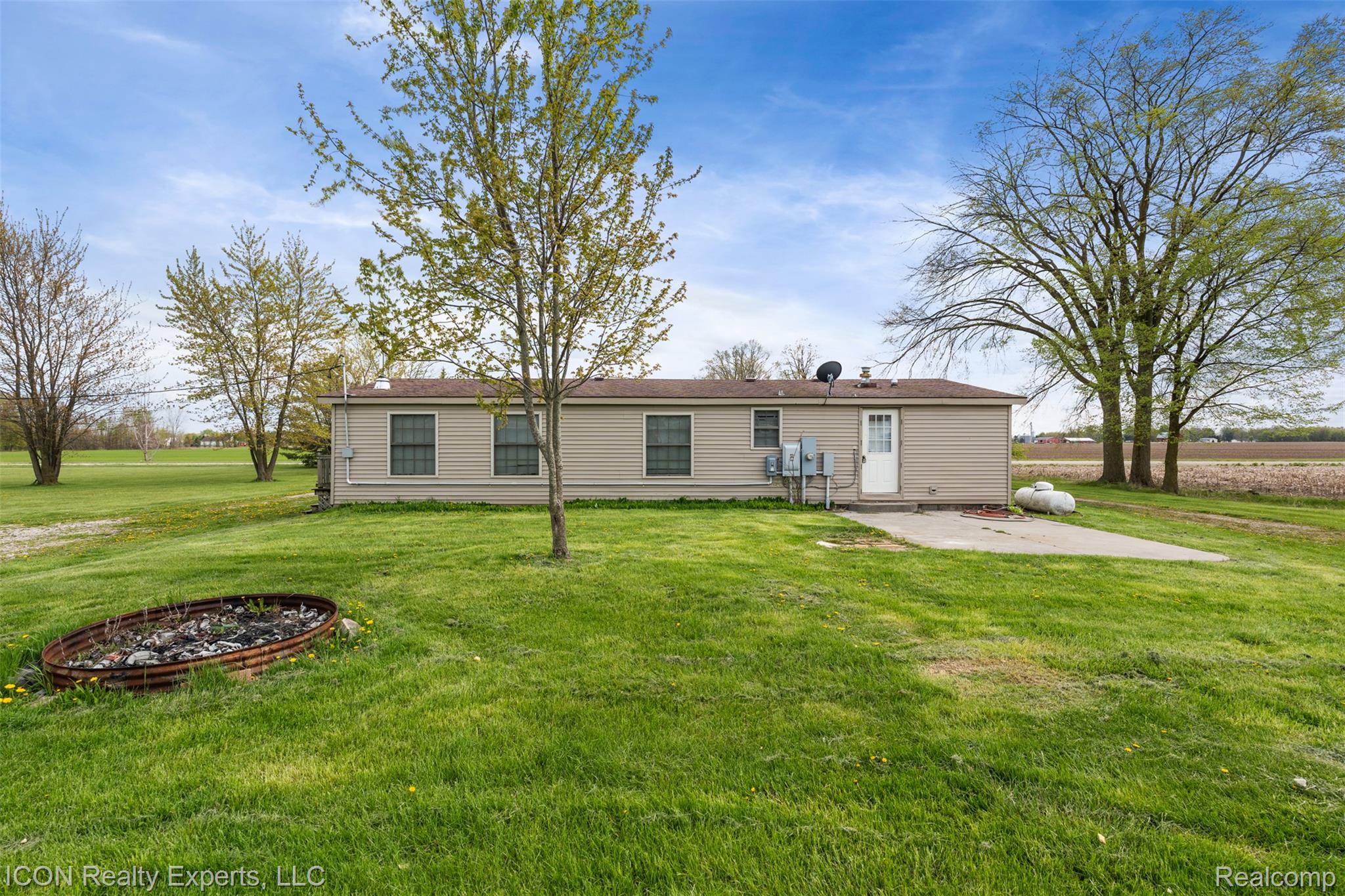 13620 Gilbert Road Allenton, MI 48002 - Photo 25 of 47 Back of house with a lawn and a patio