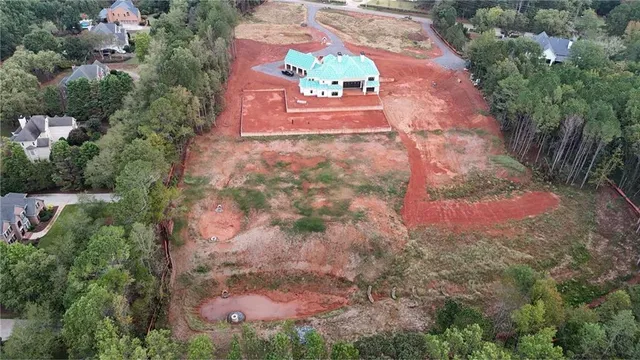 an aerial view of houses with trees