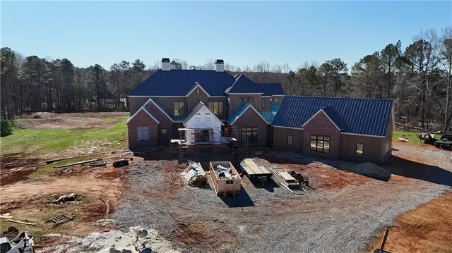 an aerial view of a house with a garden