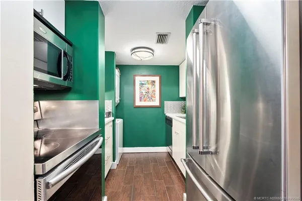 a bedroom with a bed and a flat tv screen