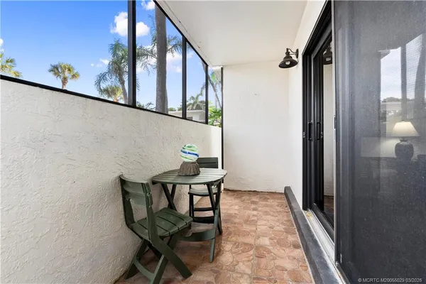 a view of a chairs and table on the terrace