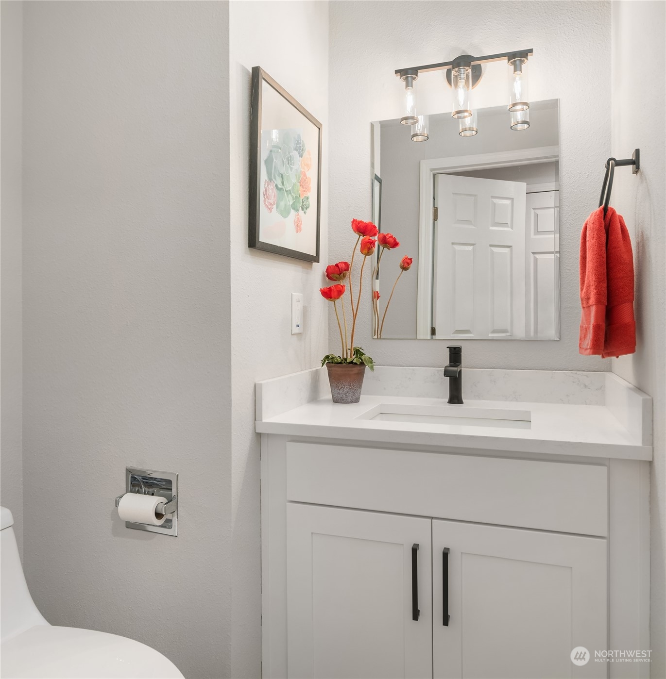 1555 Union Avenue Northeast, Unit 57 Renton, WA 98059 - Photo 12 of 28 a bathroom with a sink vanity and a toilet