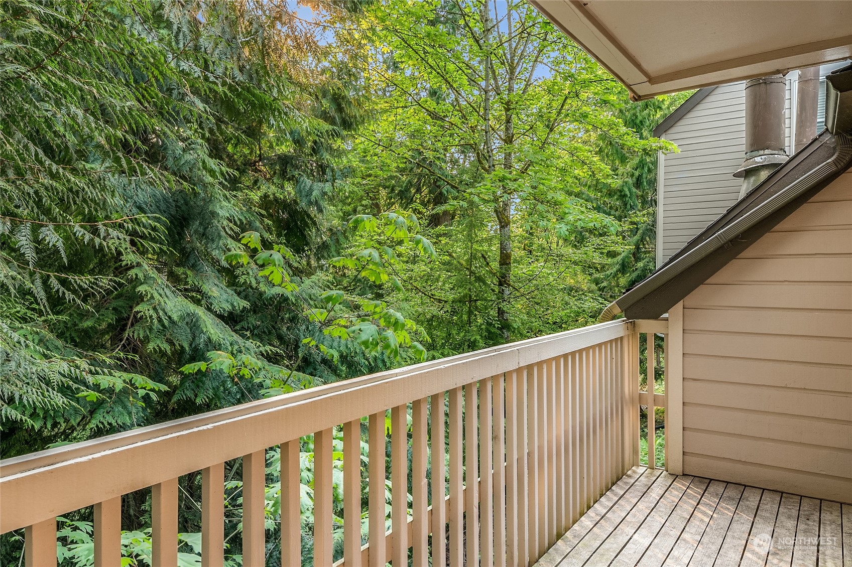 1555 Union Avenue Northeast, Unit 57 Renton, WA 98059 - Photo 13 of 28 a balcony with trees in front of it