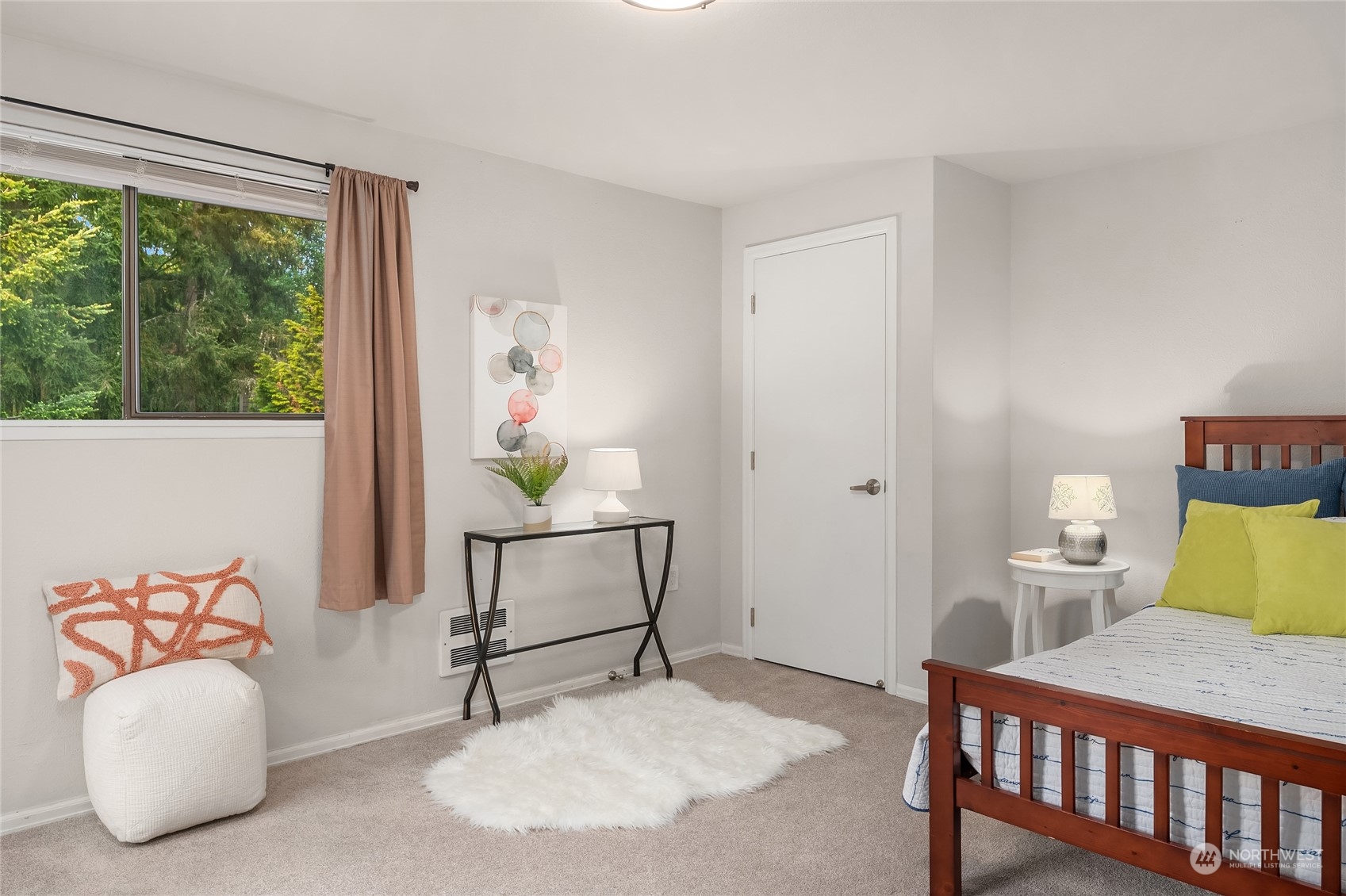 1555 Union Avenue Northeast, Unit 57 Renton, WA 98059 - Photo 24 of 28 a bedroom with furniture and a window