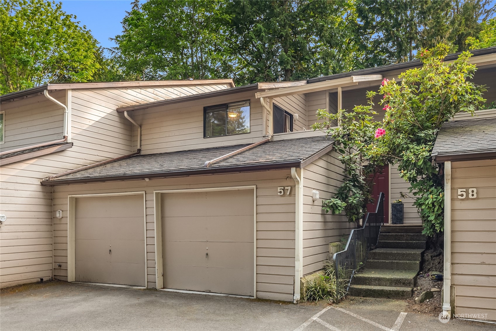 1555 Union Avenue Northeast, Unit 57 Renton, WA 98059 - Photo 27 of 28 a view of a house with a garage