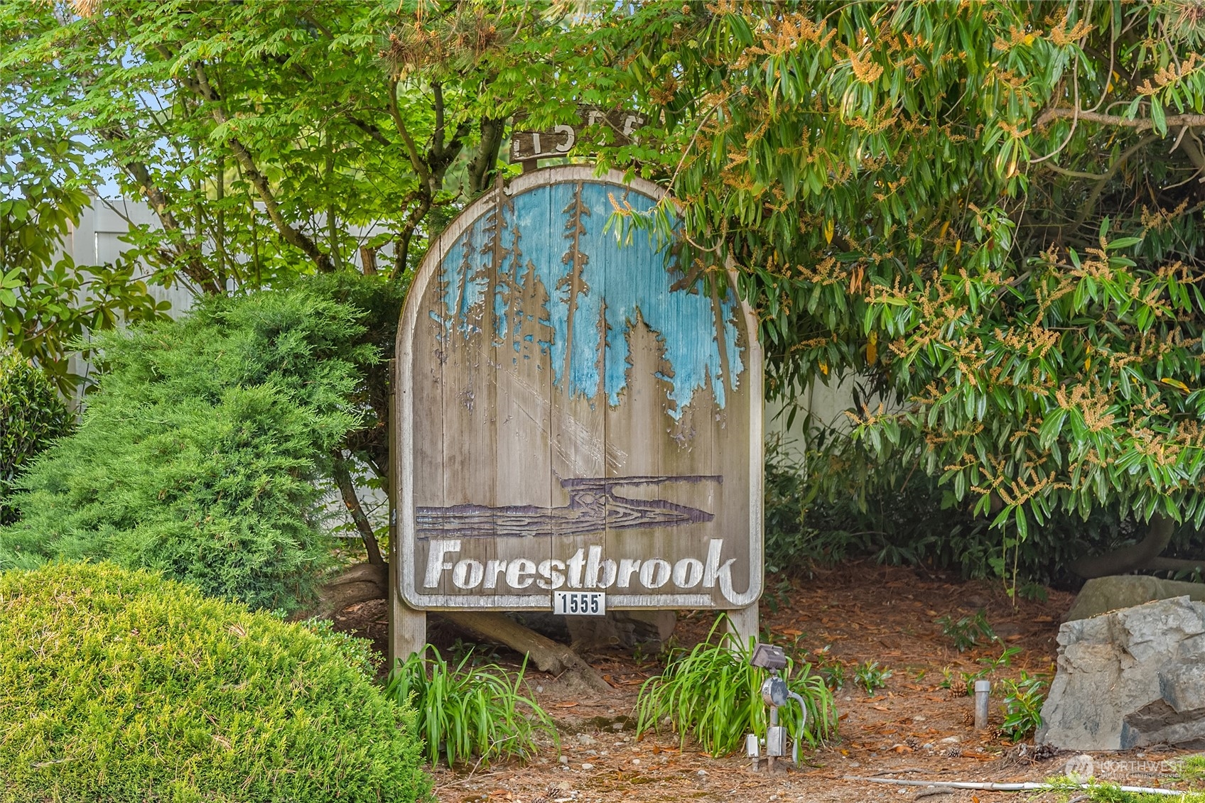1555 Union Avenue Northeast, Unit 57 Renton, WA 98059 - Photo 28 of 28 a sign that is on the side of a road