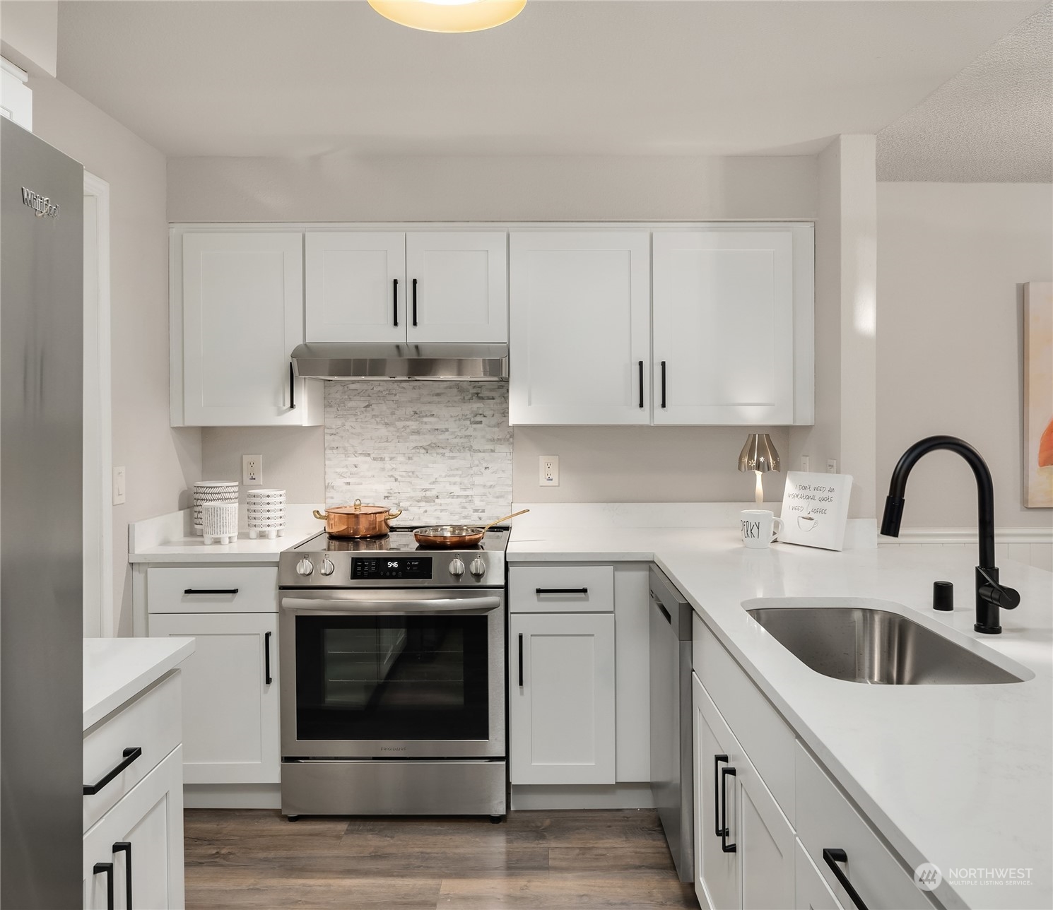 1555 Union Avenue Northeast, Unit 57 Renton, WA 98059 - Photo 5 of 28 a kitchen with stainless steel appliances granite countertop a stove sink and cabinets