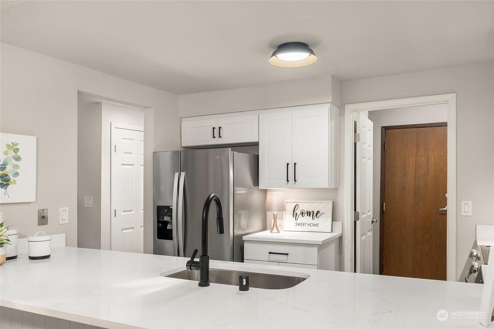 1555 Union Avenue Northeast, Unit 57 Renton, WA 98059 - Photo 6 of 28 a view of a kitchen with refrigerator and window