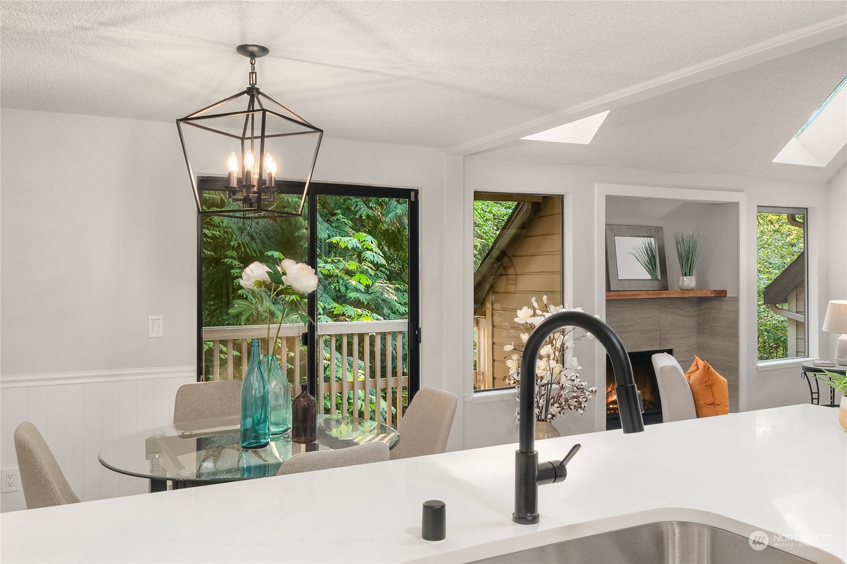 1555 Union Avenue Northeast, Unit 57 Renton, WA 98059 - Photo 9 of 28 a dining room with furniture a chandelier and window