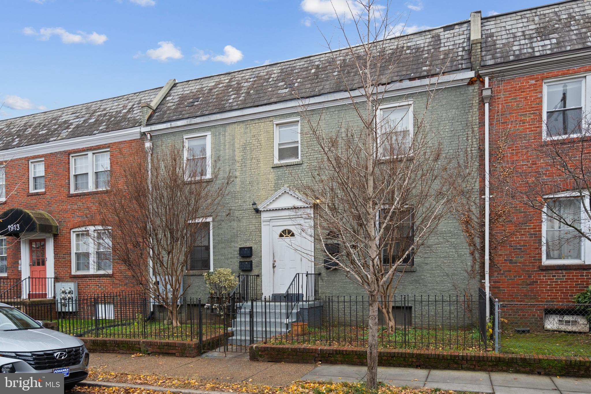 a large building with a tree in front of it