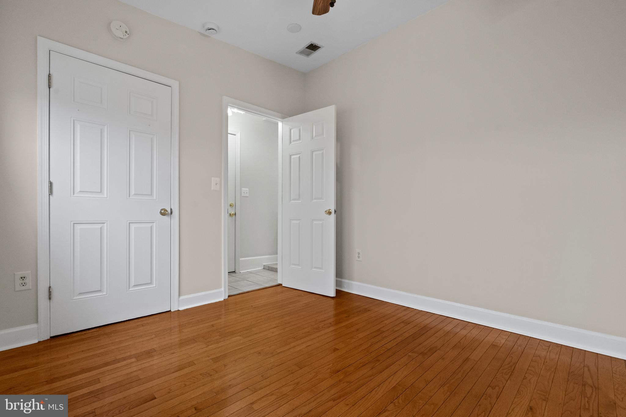 1909 Rosedale Street Northeast, Unit 3 Washington, DC 20002 - Photo 15 of 23 a view of an empty room with wooden floor