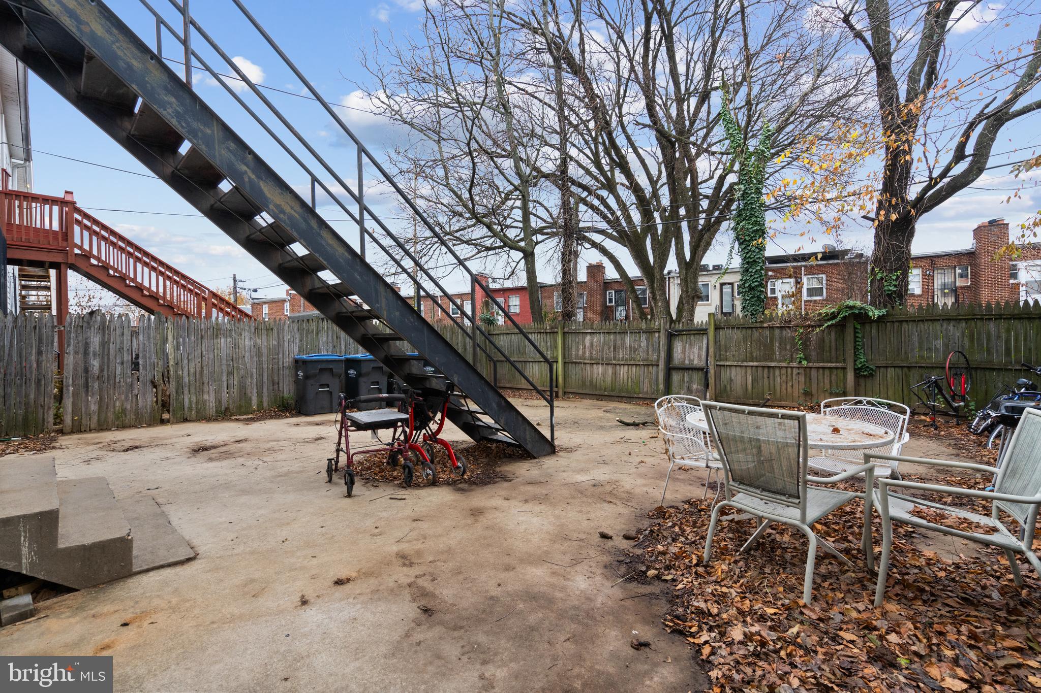 1909 Rosedale Street Northeast, Unit 3 Washington, DC 20002 - Photo 16 of 23 a view of backyard with a table and chairs and wooden fence