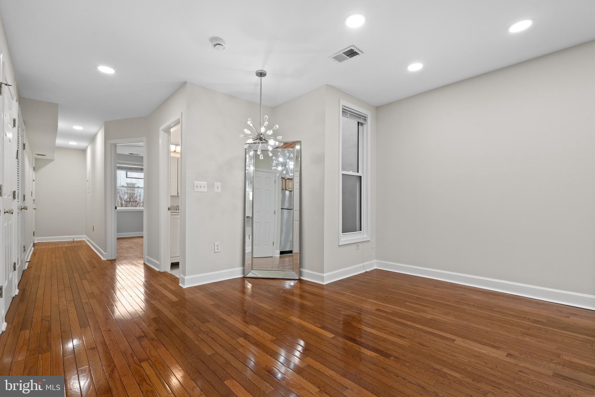 1909 Rosedale Street Northeast, Unit 3 Washington, DC 20002 - Photo 3 of 23 a view of livingroom with hardwood floor and window