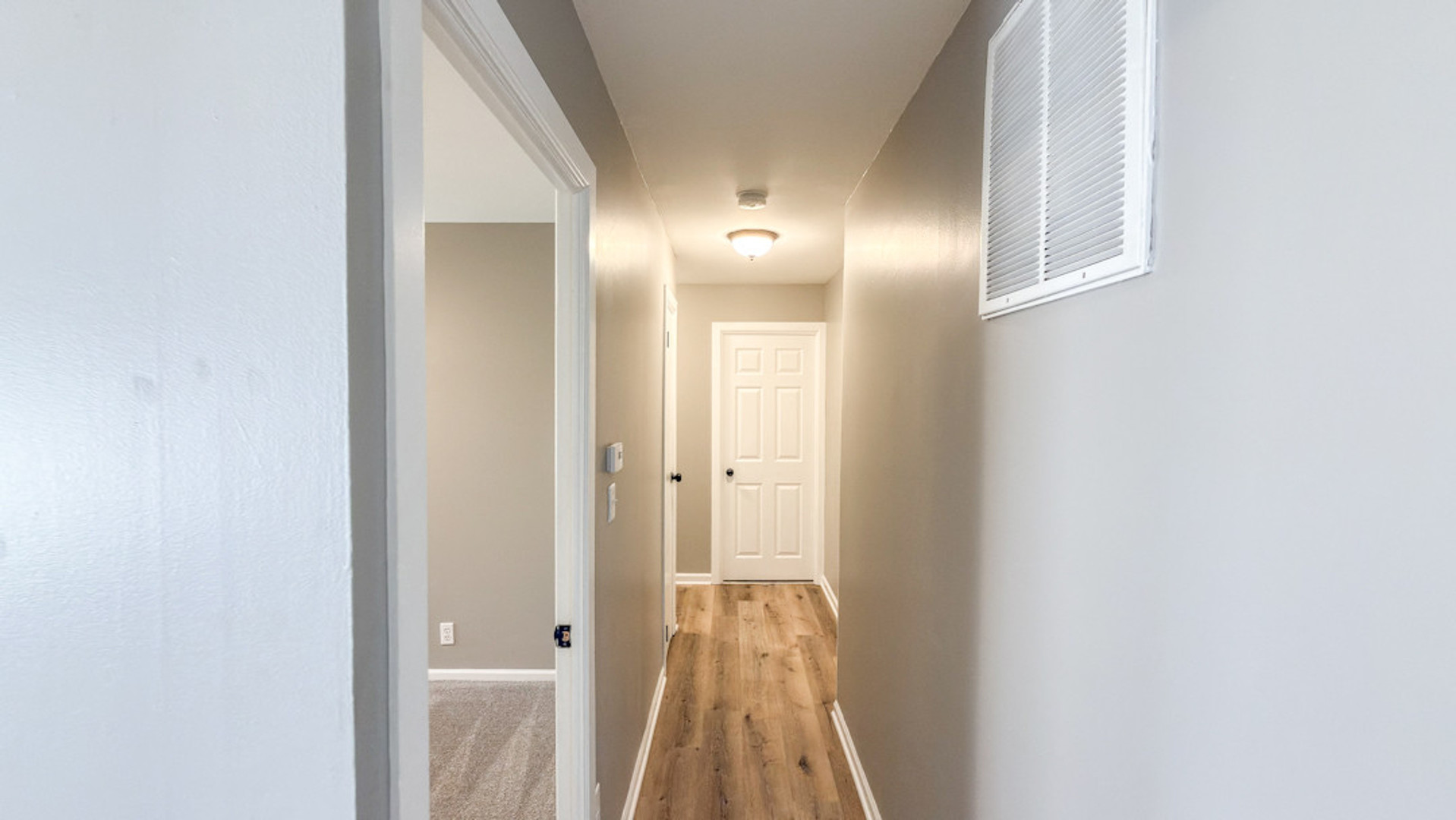 3334 Ridgewood Drive Champaign, IL 61821 - Photo 6 of 9 a view of a hallway with wooden floor